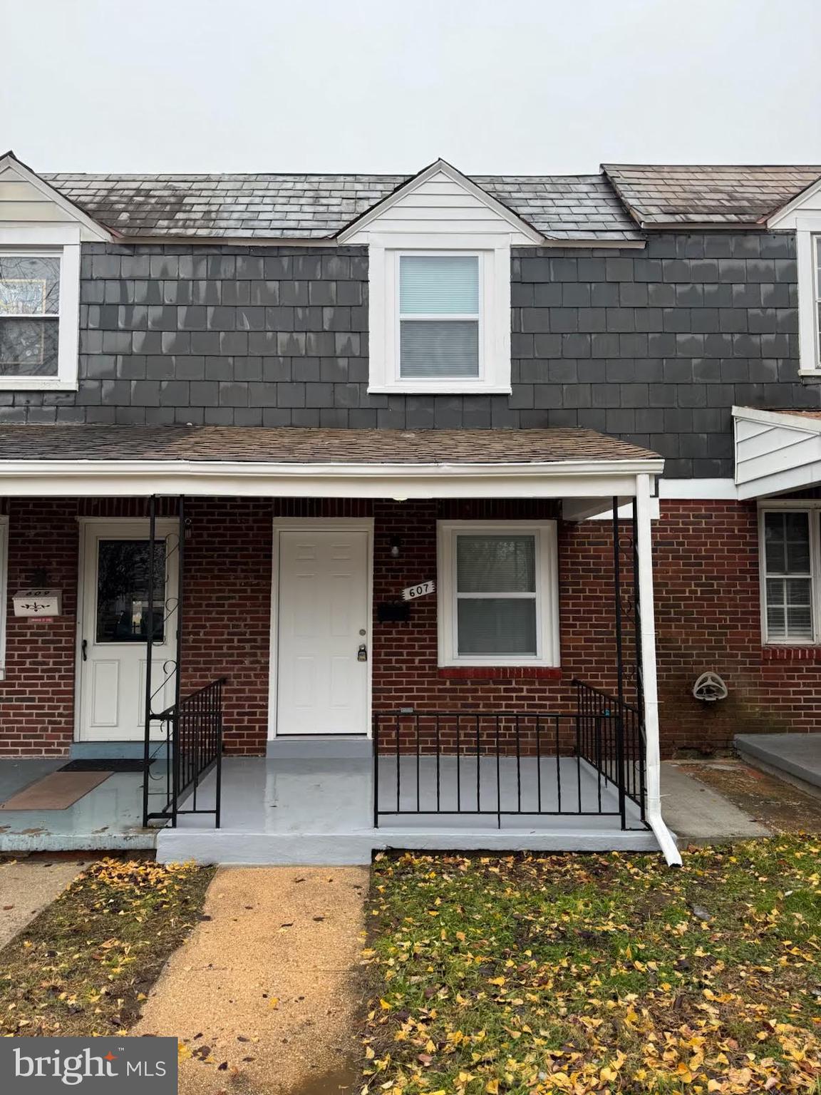 a front view of a house with garage