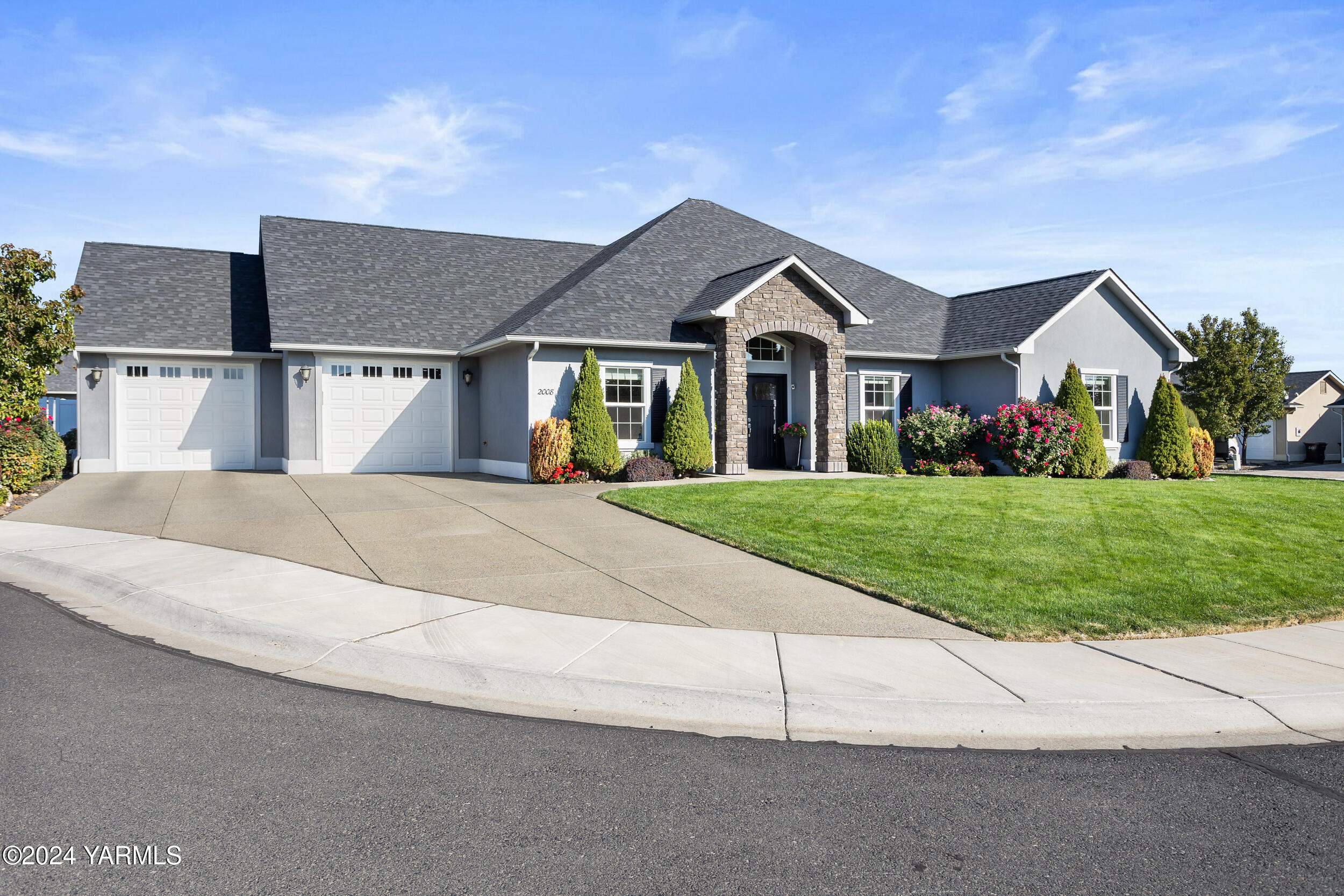 a front view of house with yard and green space