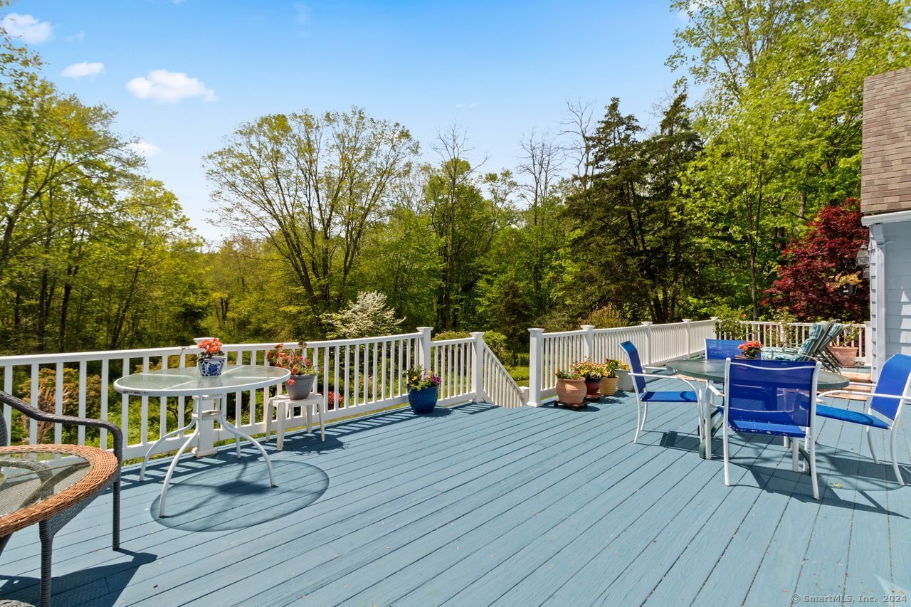 a view of a deck with furniture