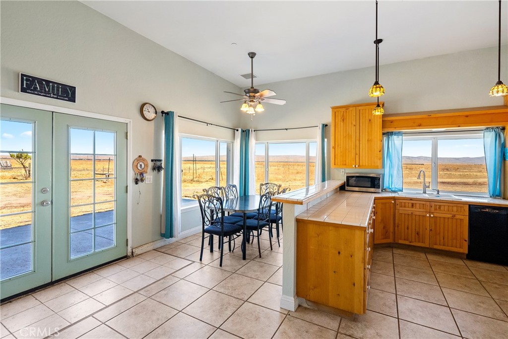 a view of a dining room with furniture window and outside view