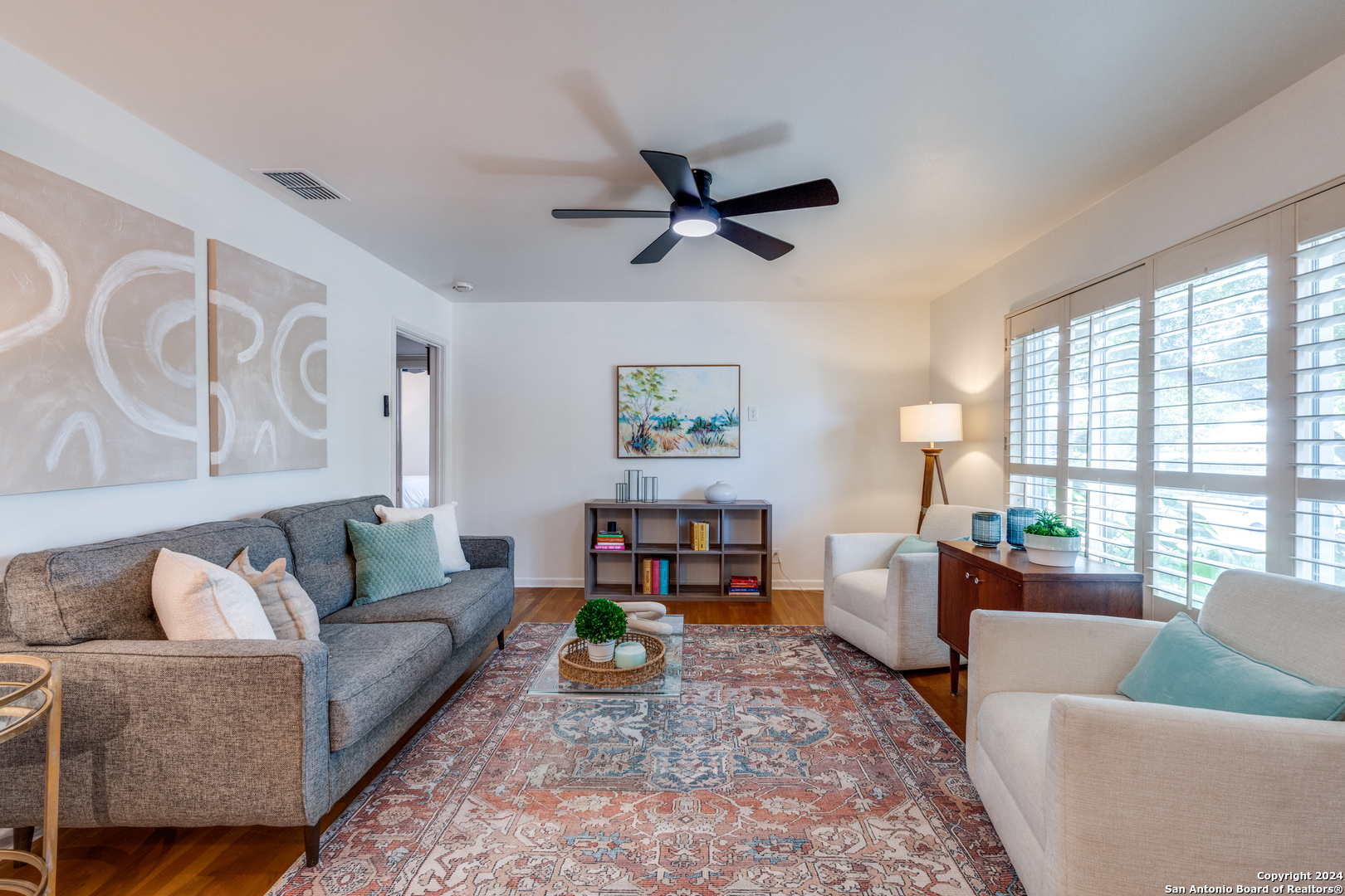 a living room with furniture and a large window