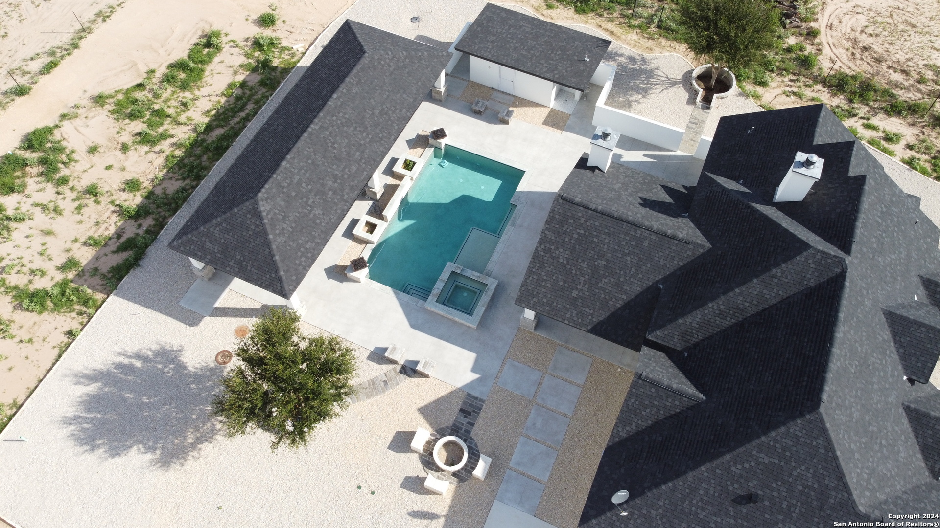 an aerial view of house with yard