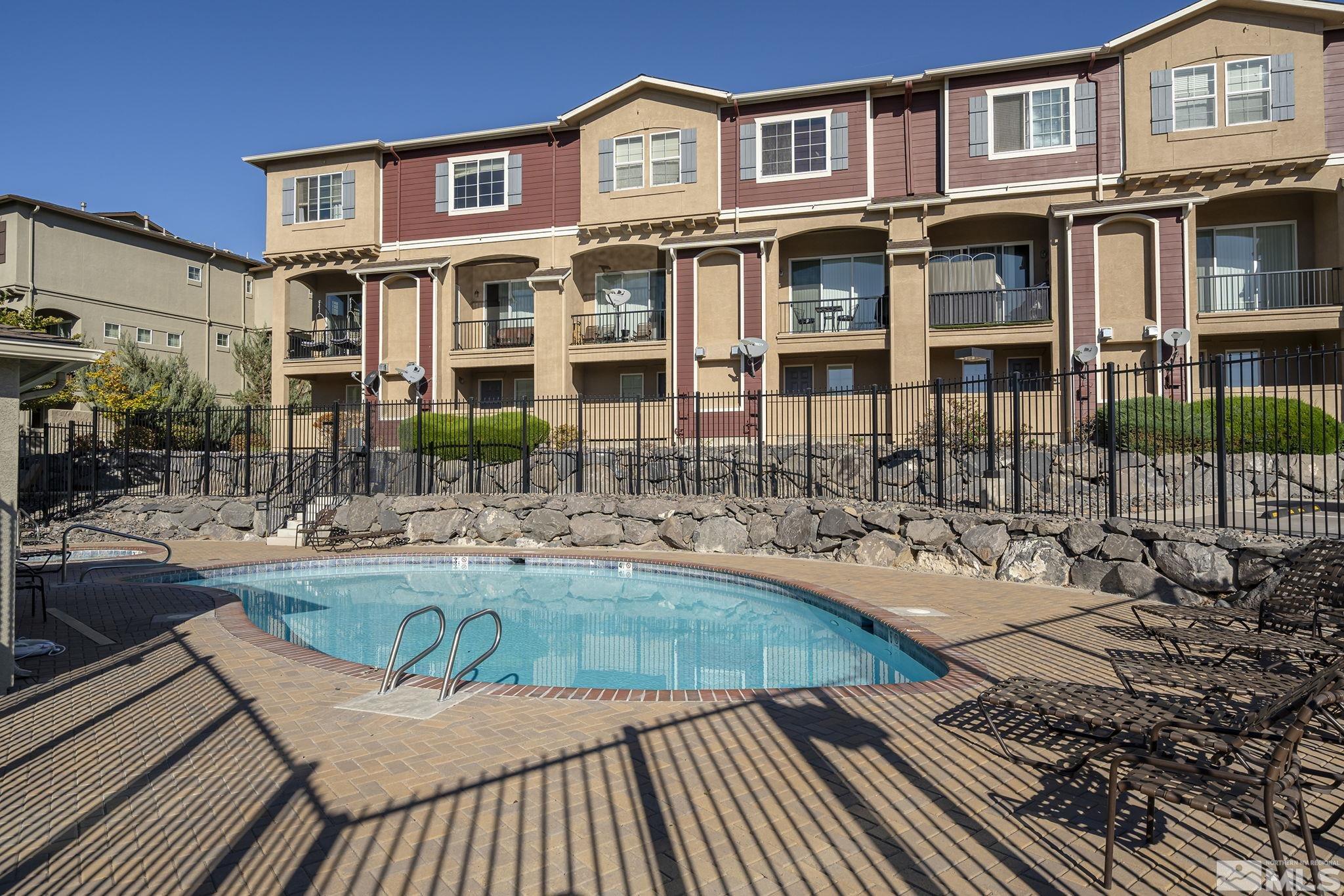 a front view of a house with swimming pool