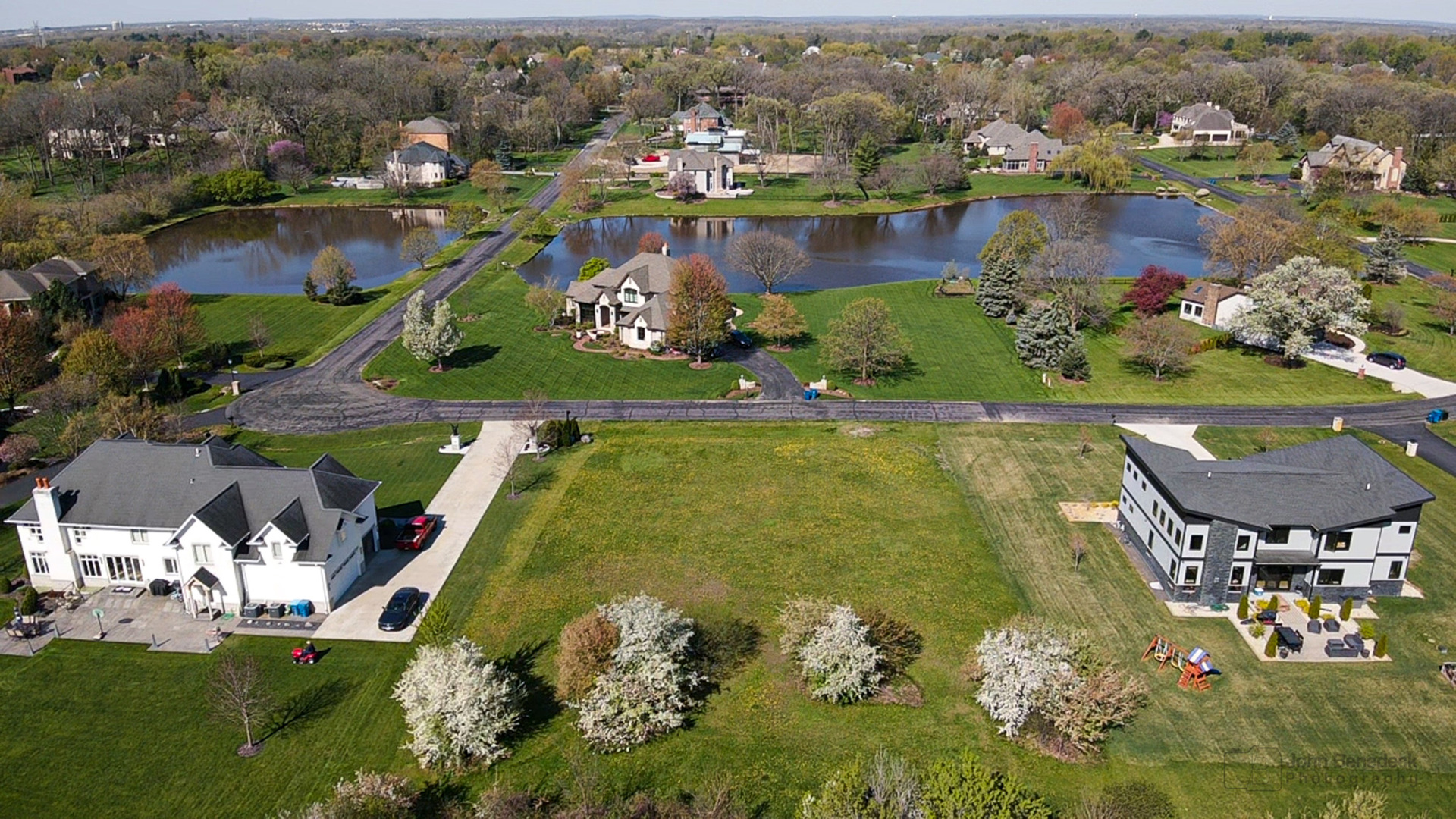 an aerial view of residential houses with outdoor space