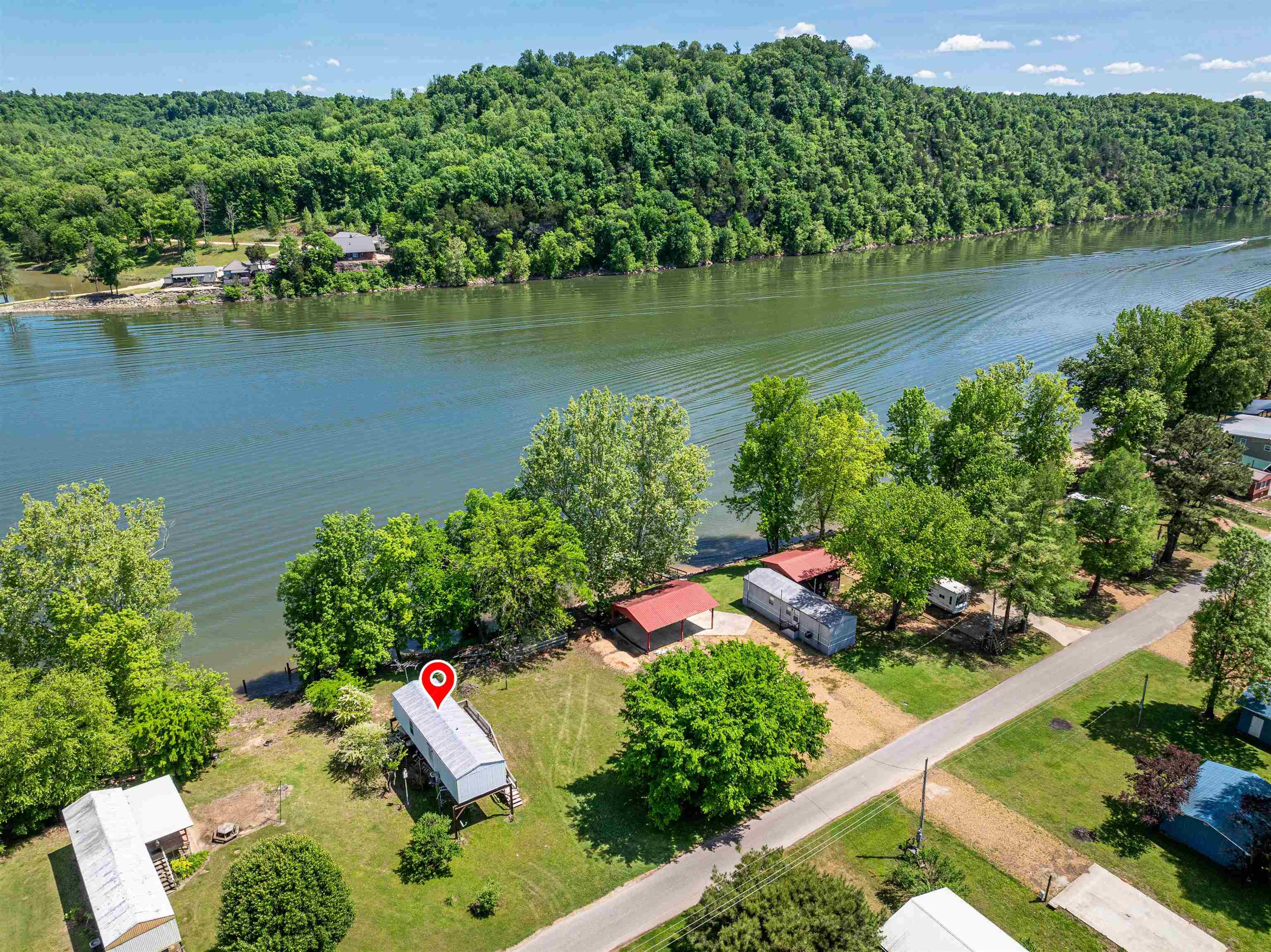 an aerial view of residential house with outdoor space and lake view