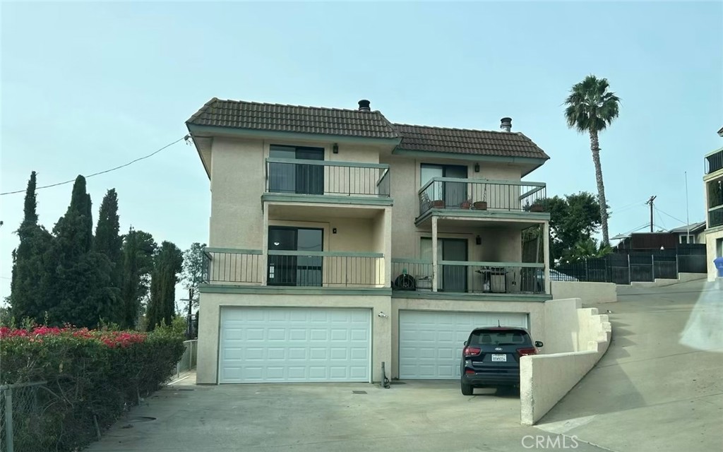 a view of a house with a garden