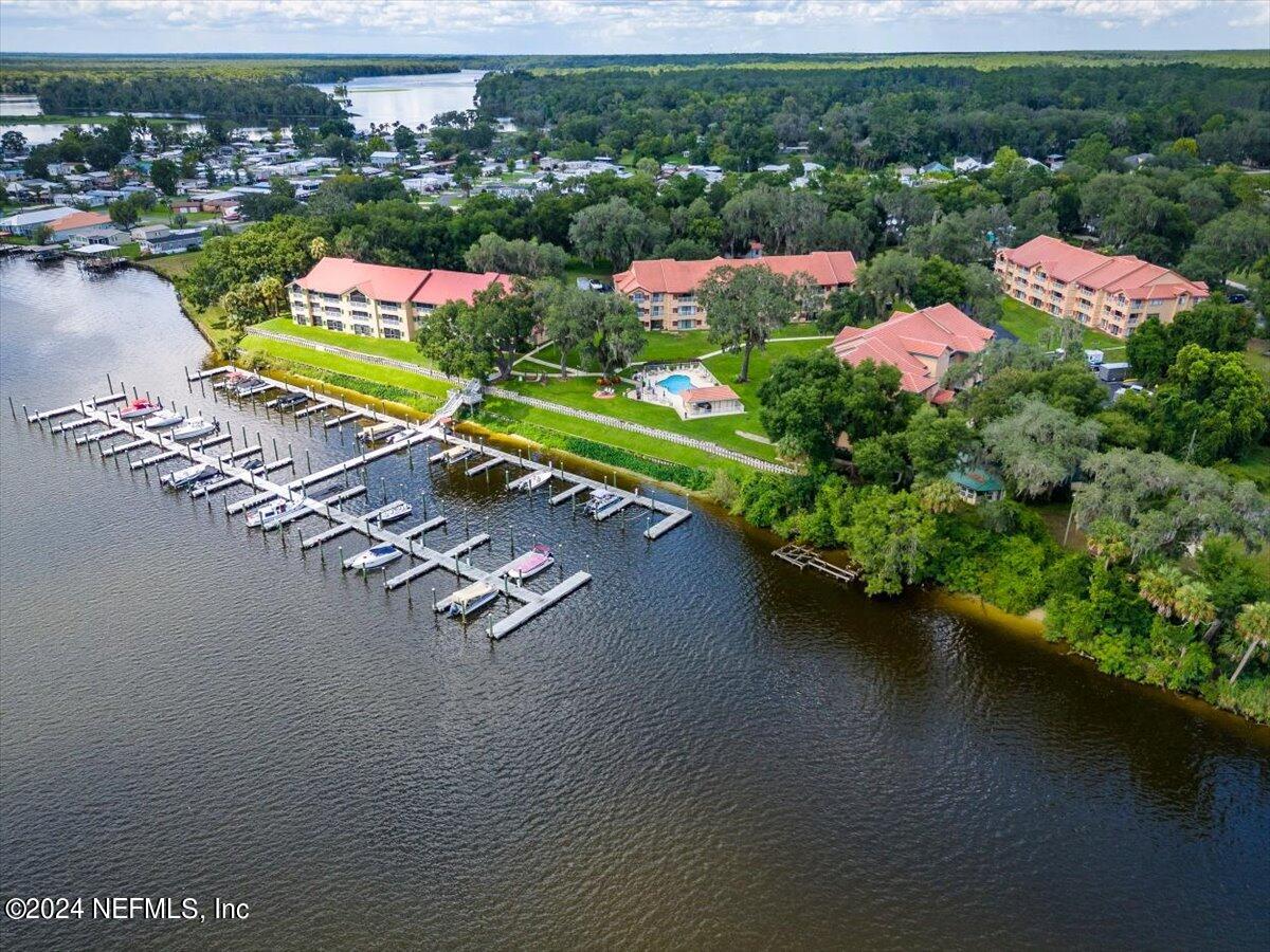 an aerial view of a houses with a lake view