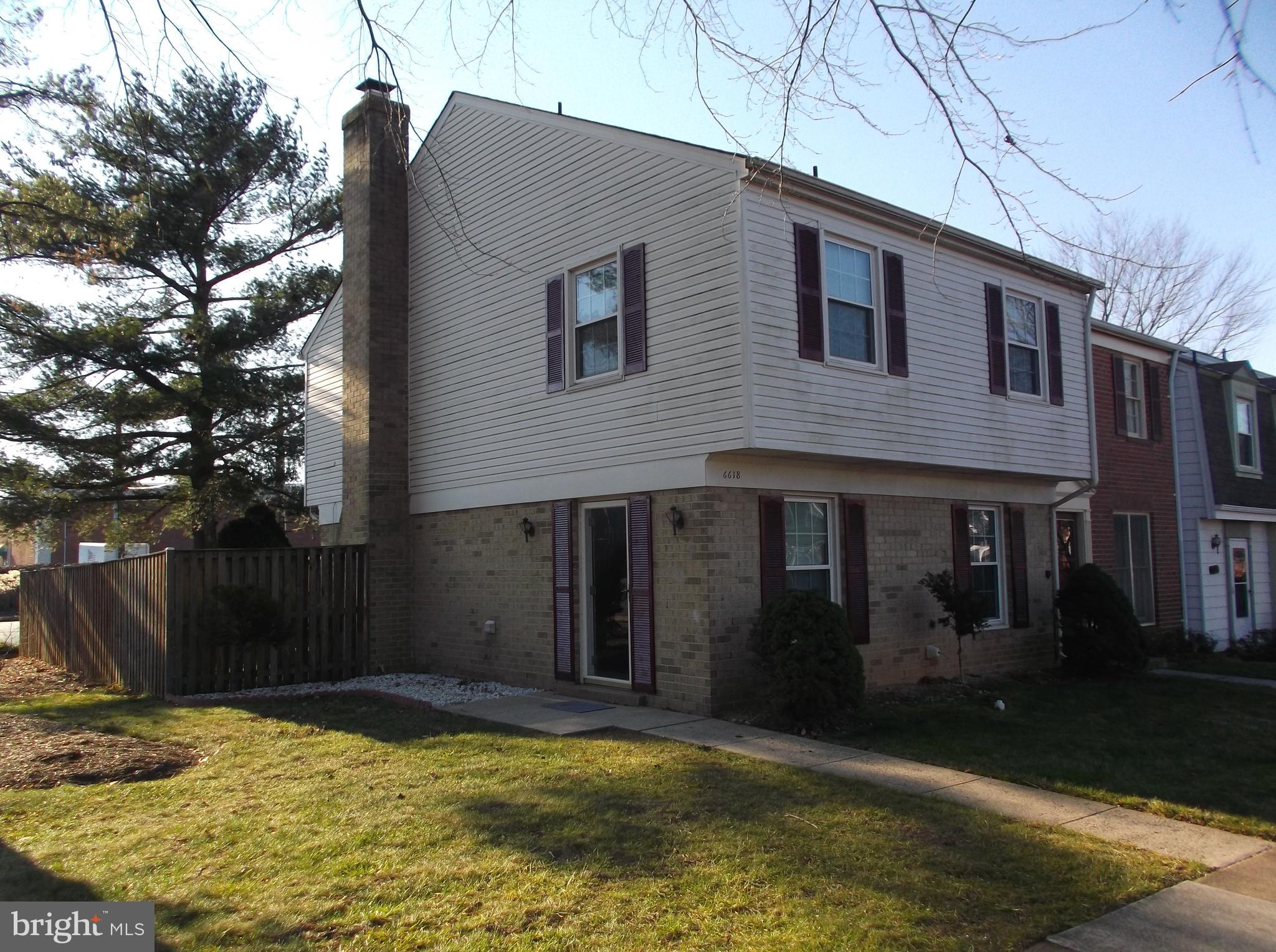 a view of house with yard in front of it