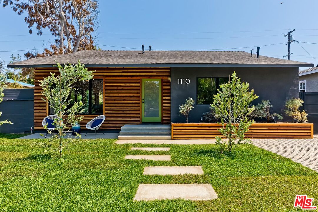 a view of a porch with a bench in a patio