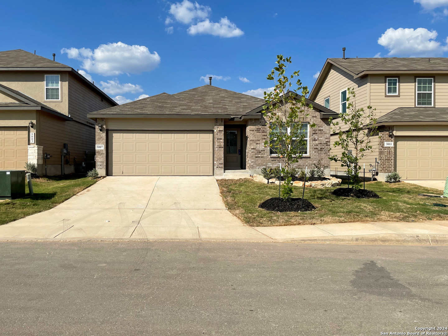 a front view of a house with yard