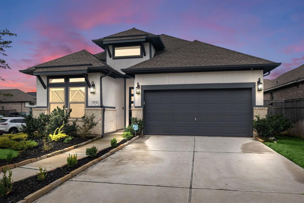 a front view of a house with a garage