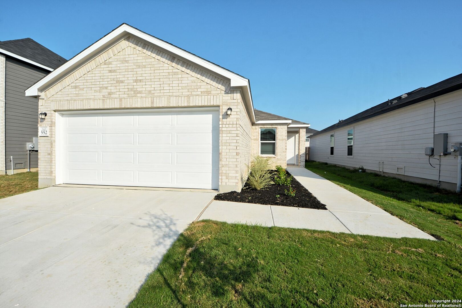 a view of a backyard of a house