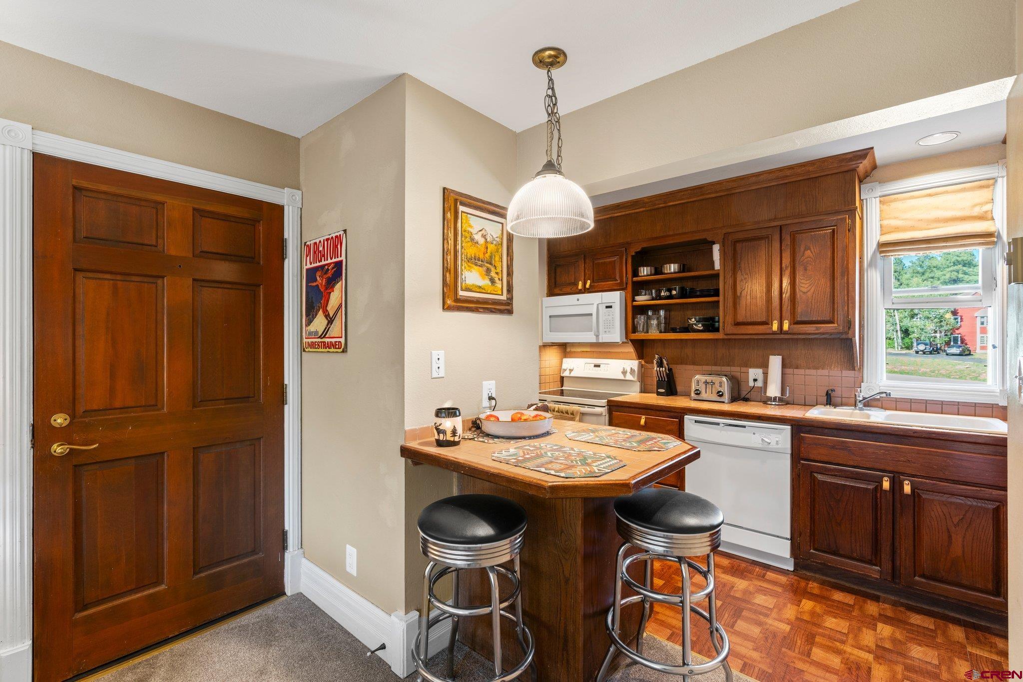 a kitchen with a sink stove and microwave