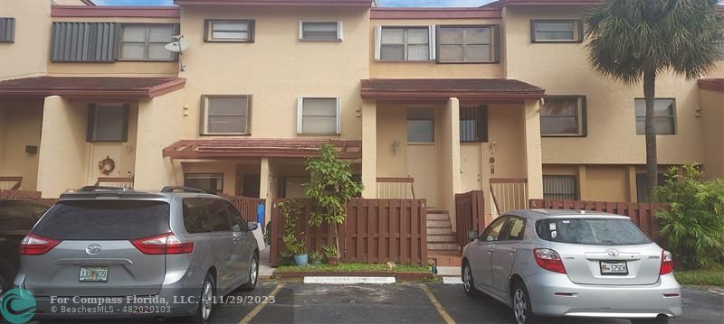 a front view of a house with parking space