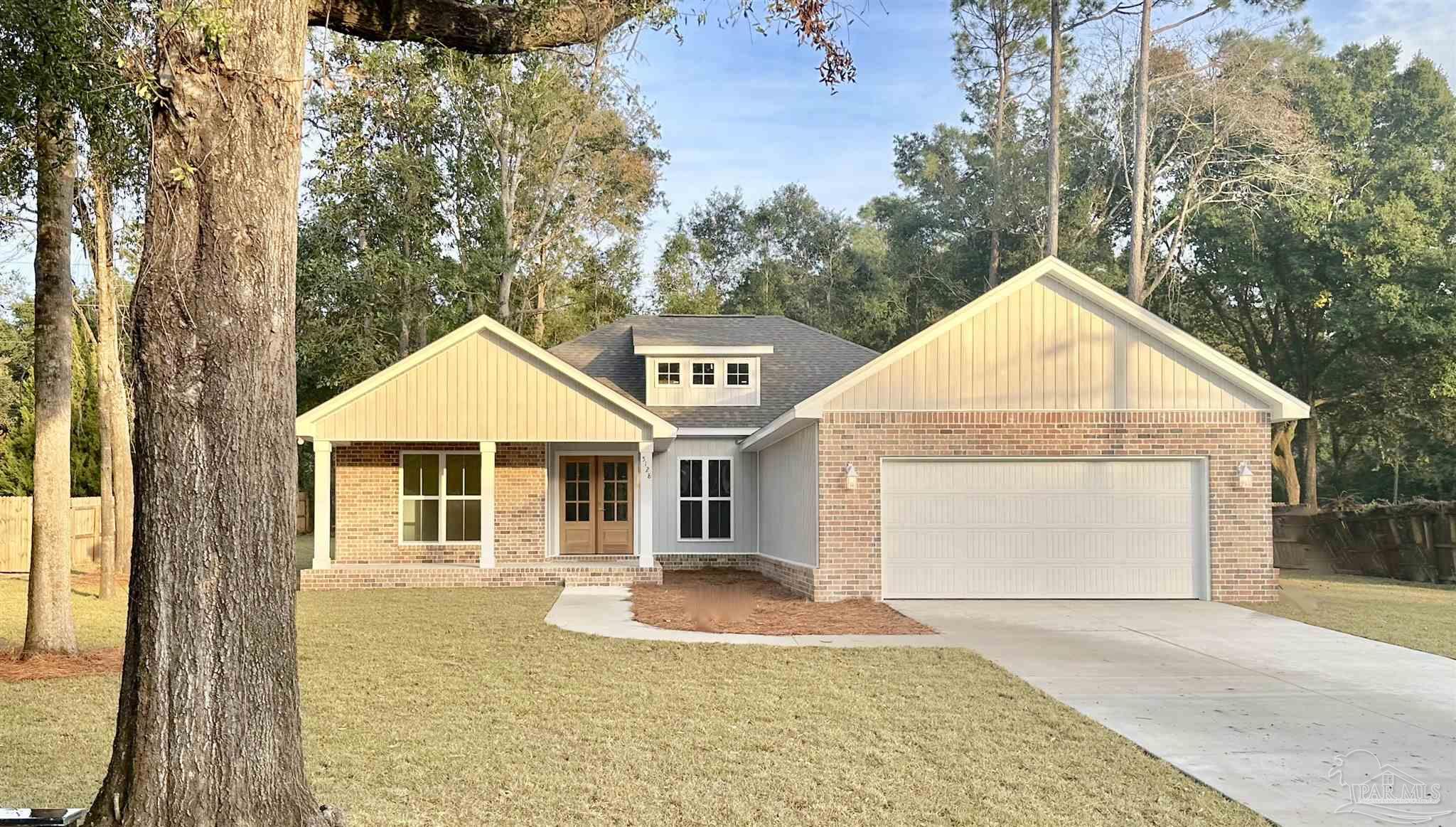 a front view of a house with yard