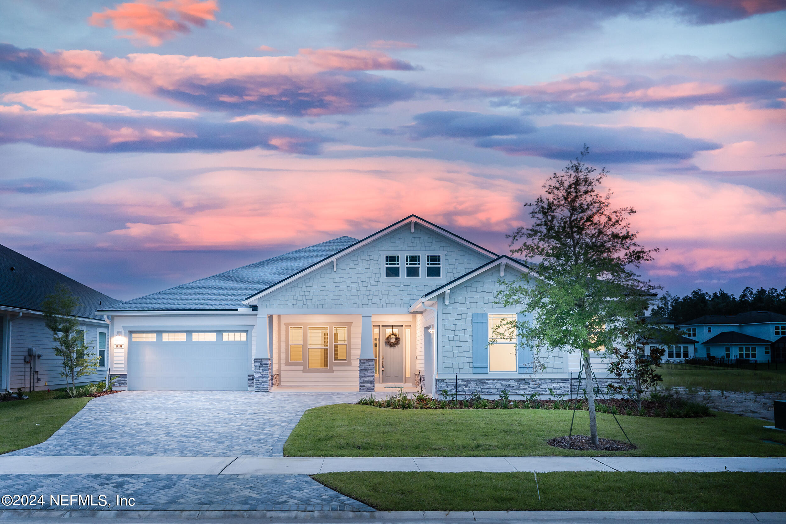 a front view of a house with a yard