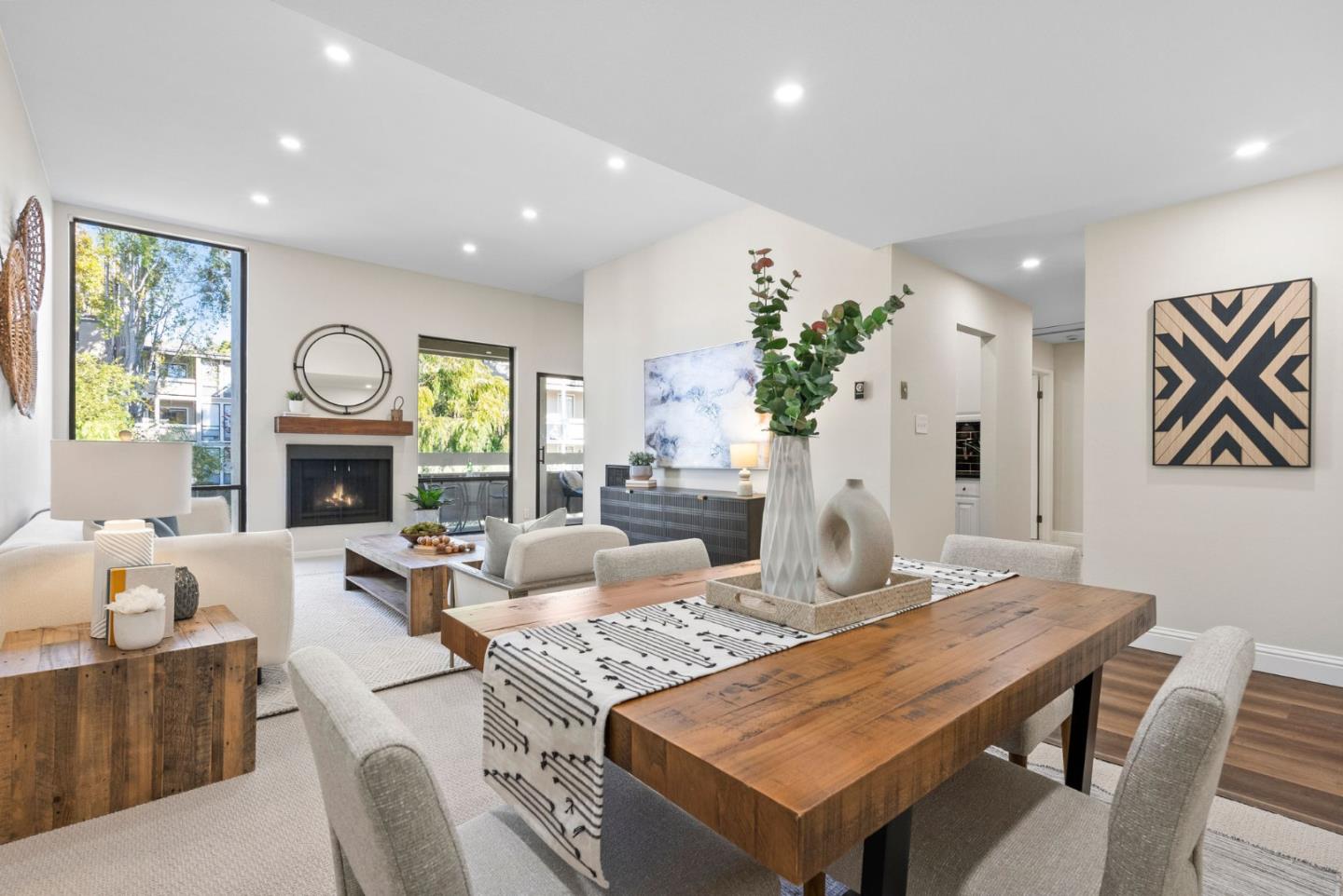 a living room with fireplace furniture and a wooden floor