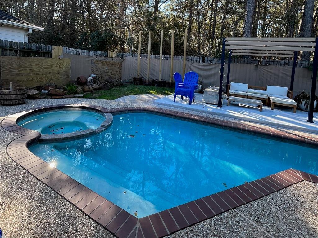 a view of a swimming pool with a patio