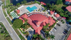 an aerial view of a house with a yard and garden