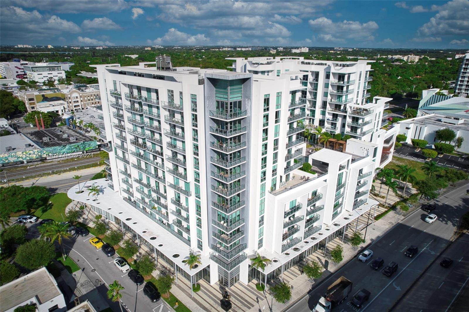 an aerial view of residential building and parking space