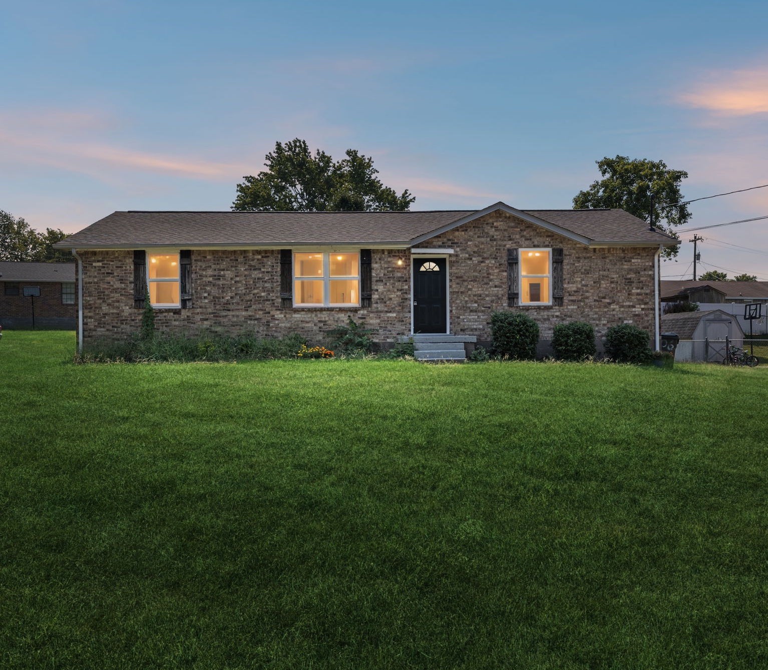 a brick house with a yard