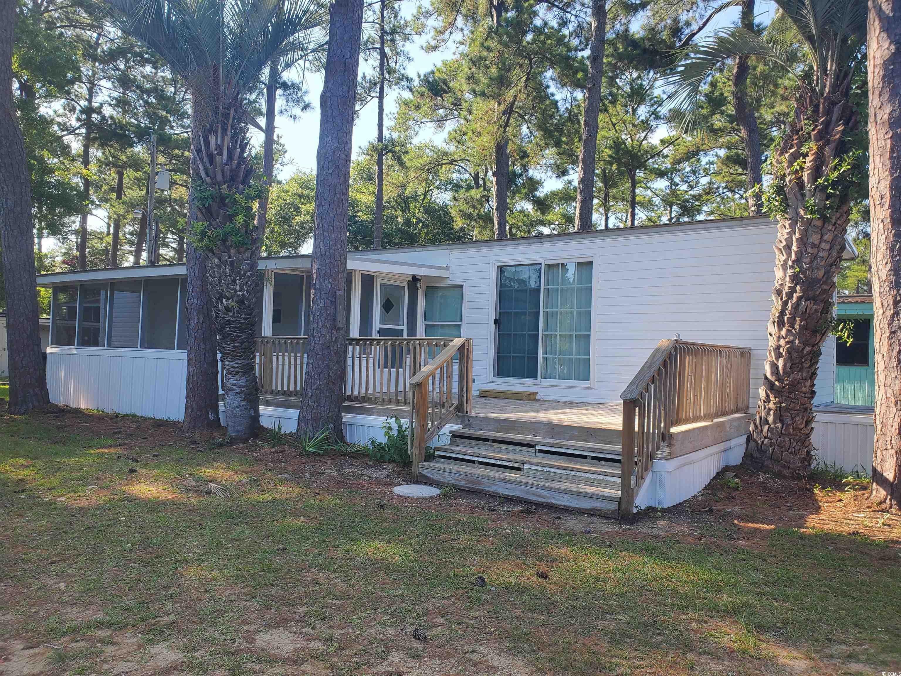 Rear view of house with a deck