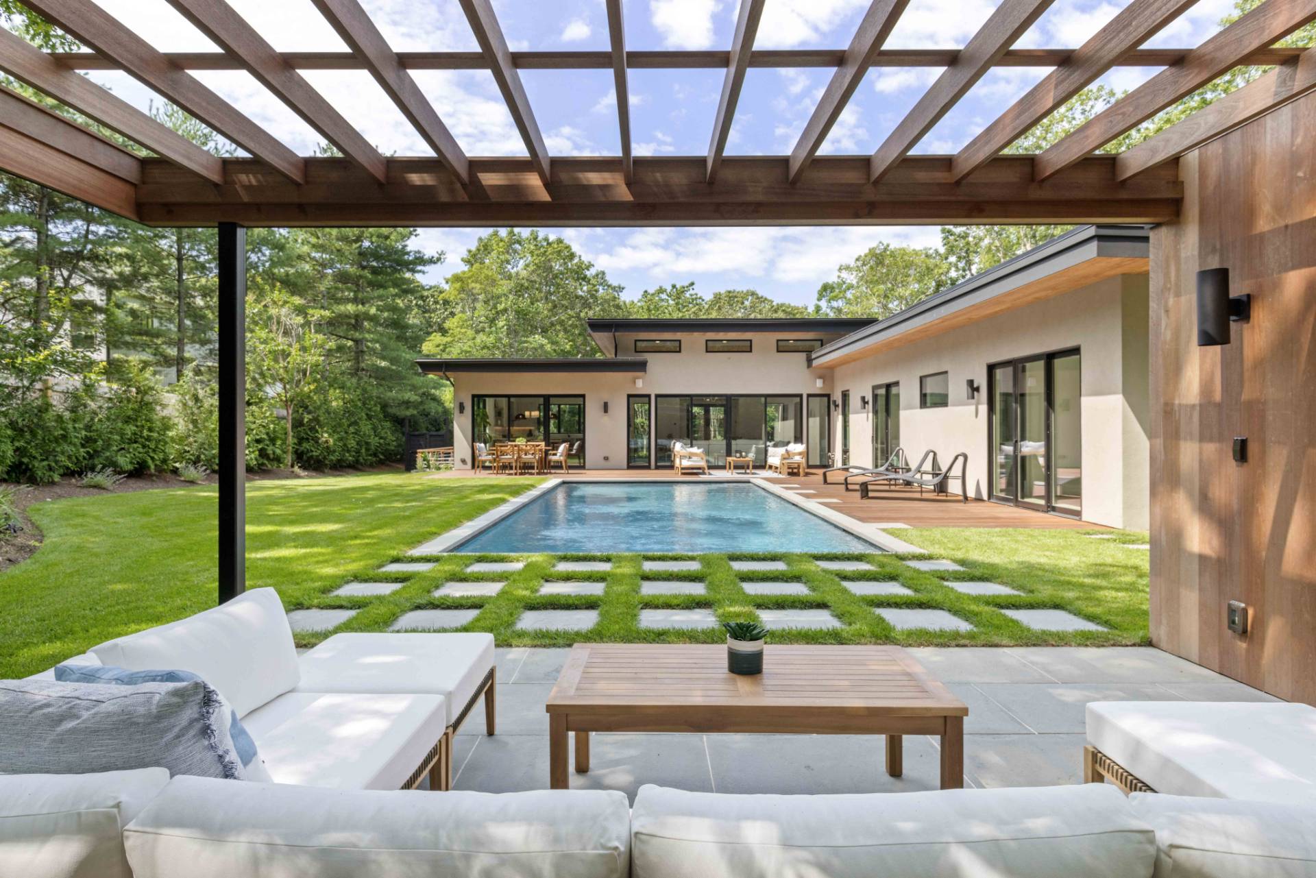 a view of yard with swimming pool outdoor seating area and green space