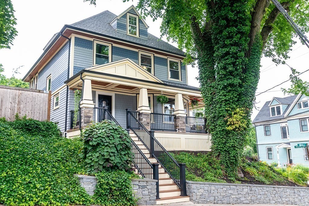 a front view of a house with garden