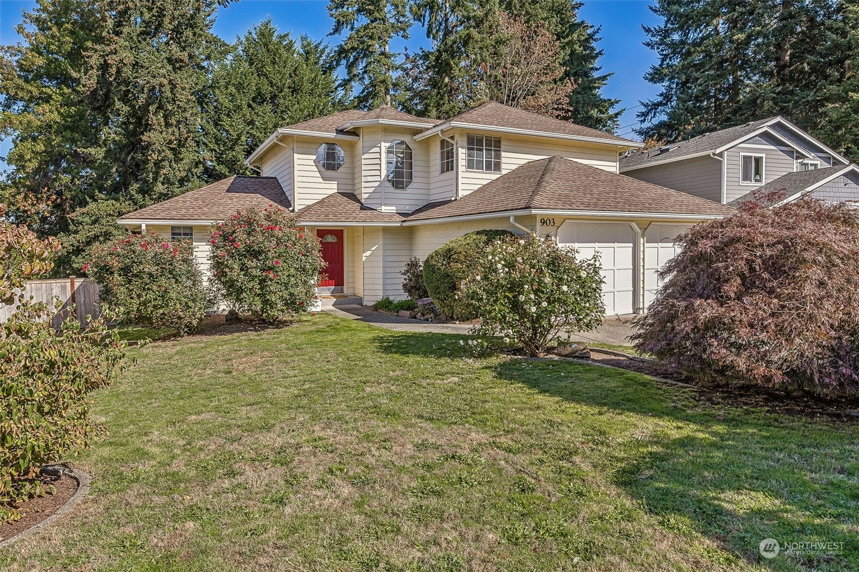 a front view of a house with a yard