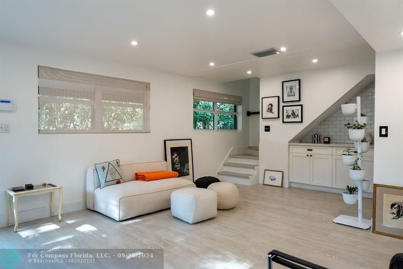 a bedroom with furniture and a chandelier