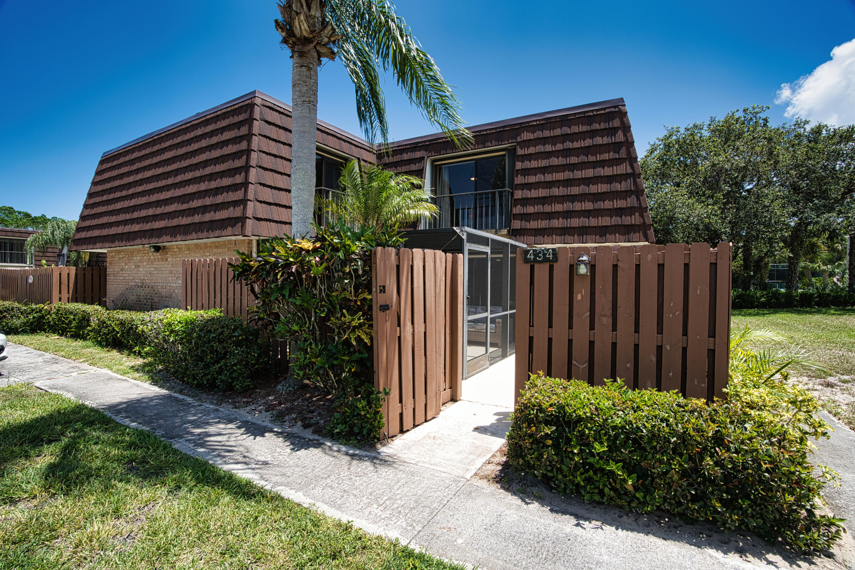 a front view of house with pathway and yard