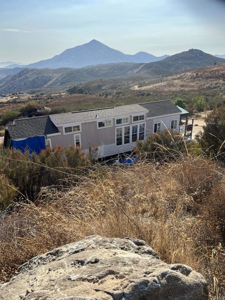 a view of a house with a mountain