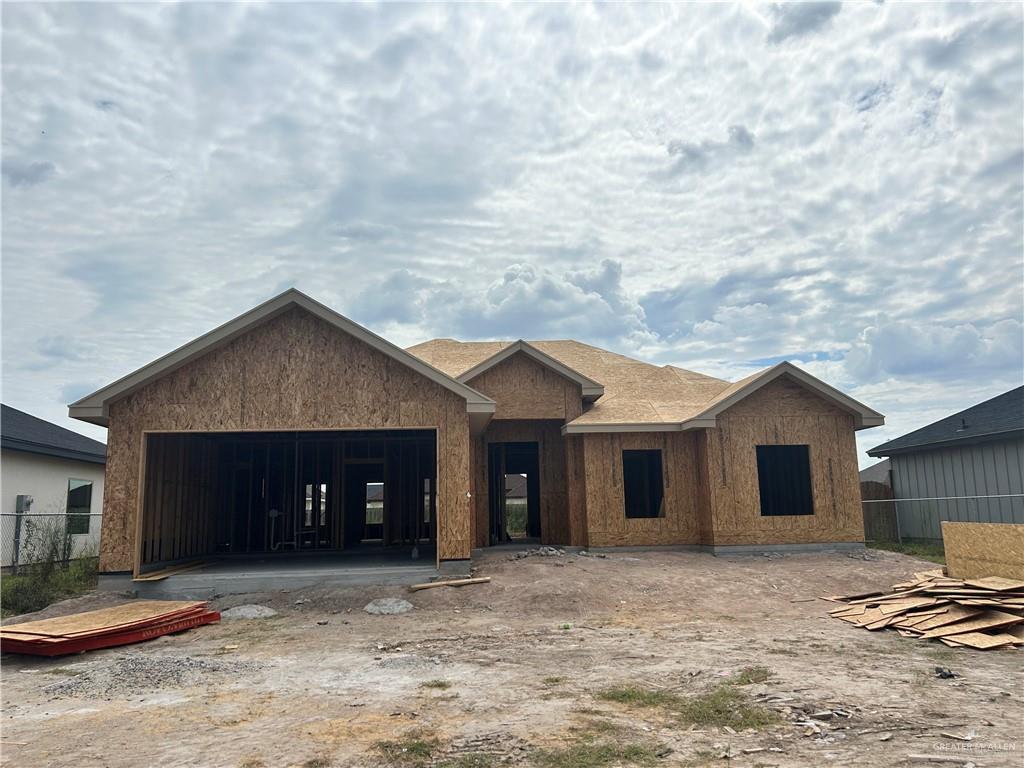 Property in mid-construction featuring a garage