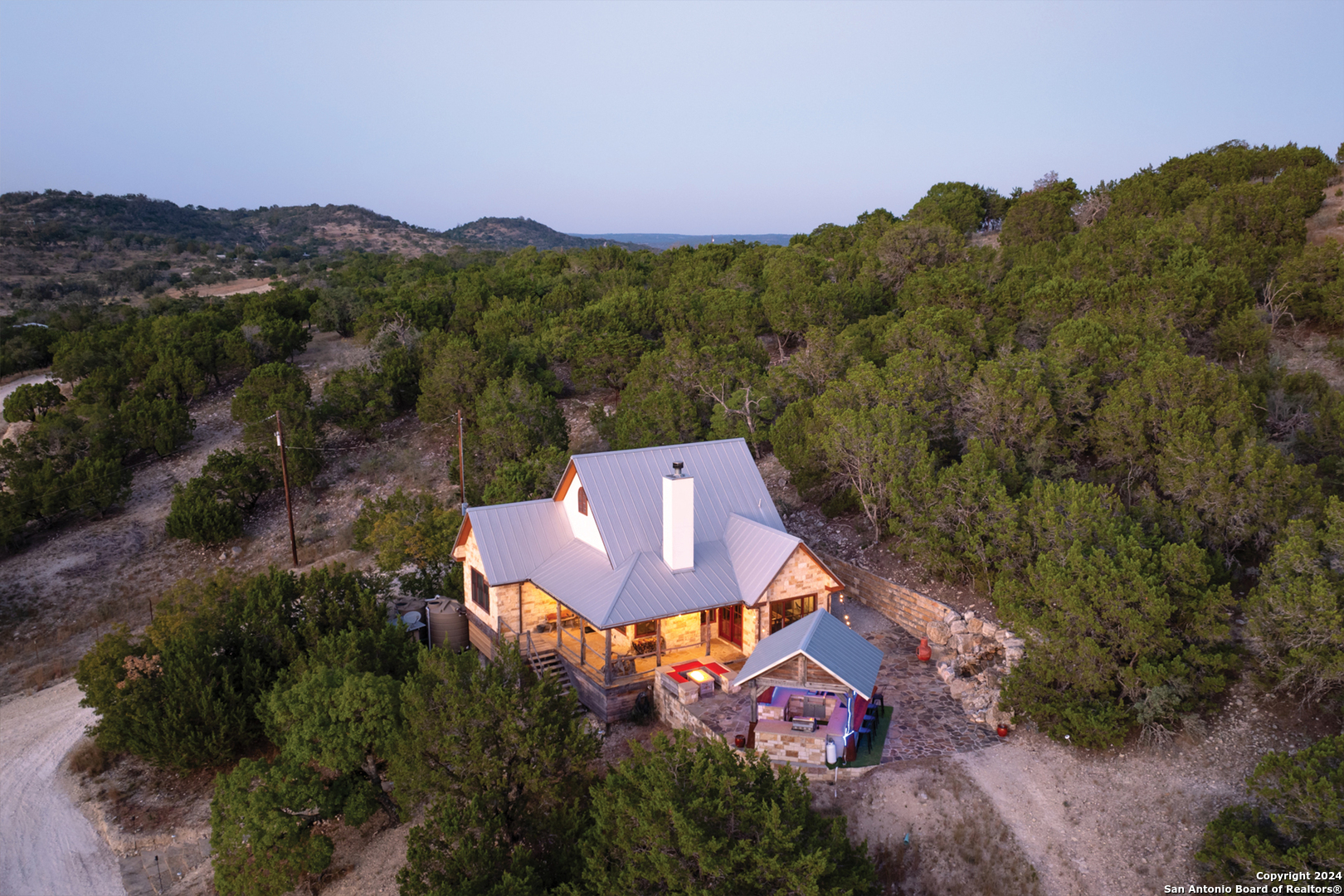 an aerial view of a house with a yard