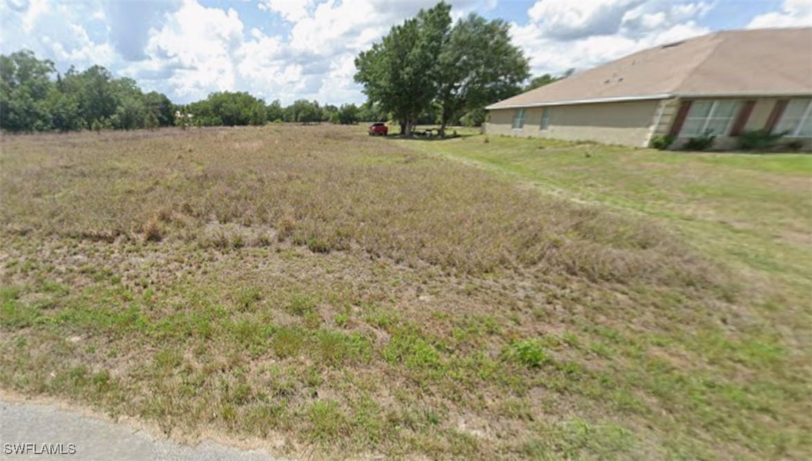 a view of a backyard of the house