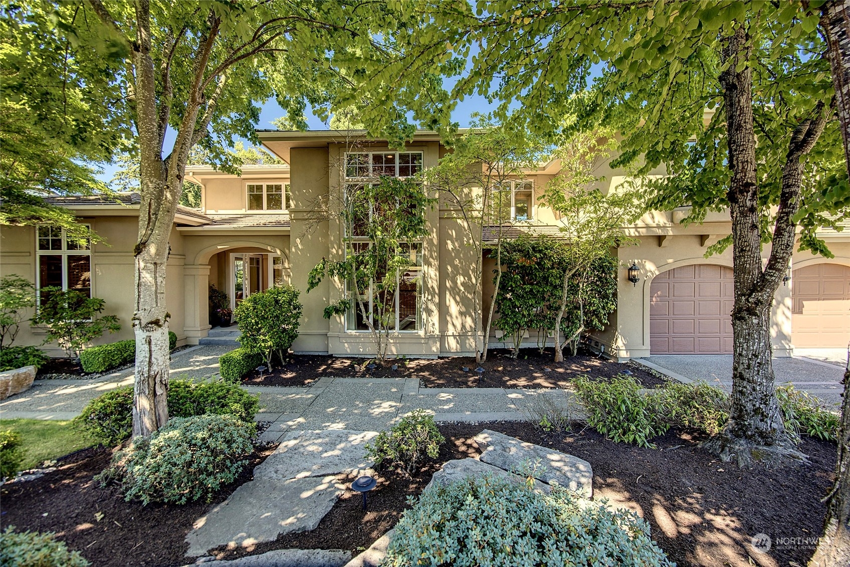 a front view of a house with garden