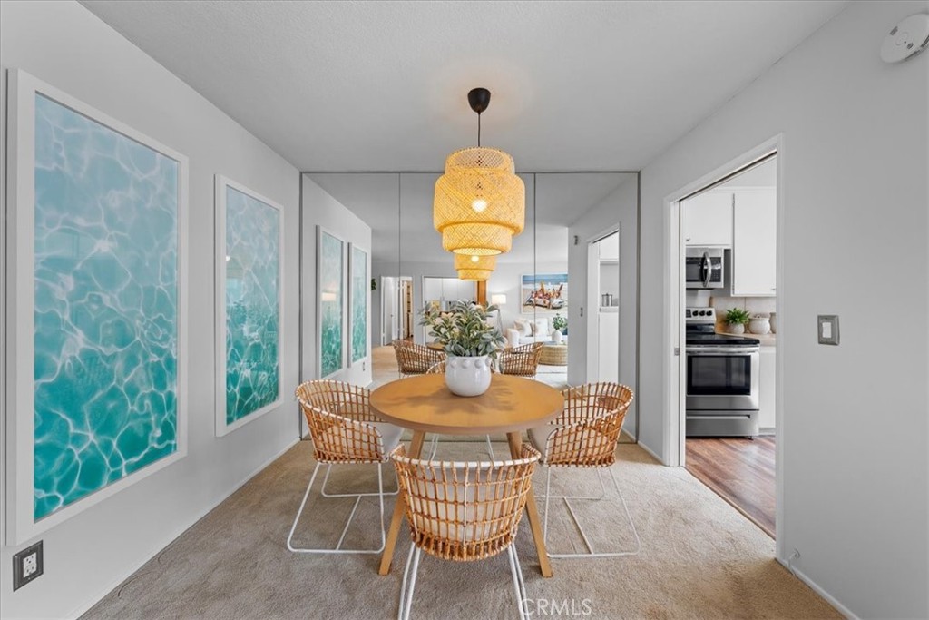 a dining room with furniture and window