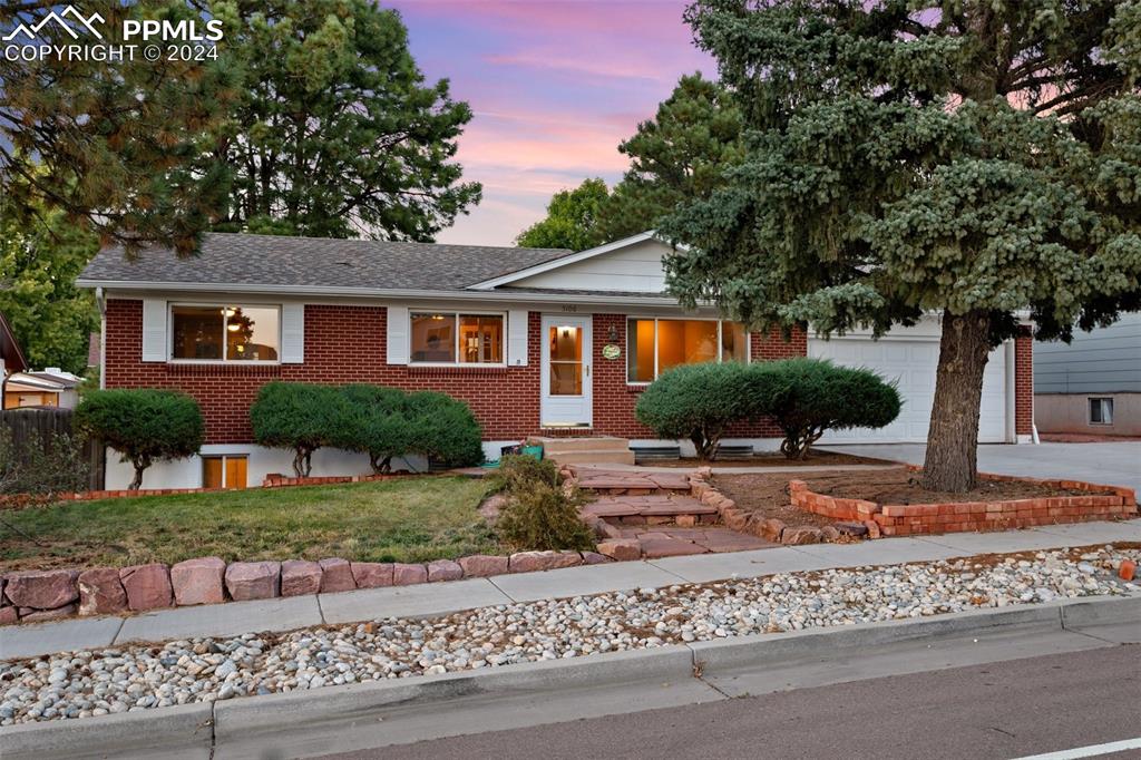 front view of a house with a yard