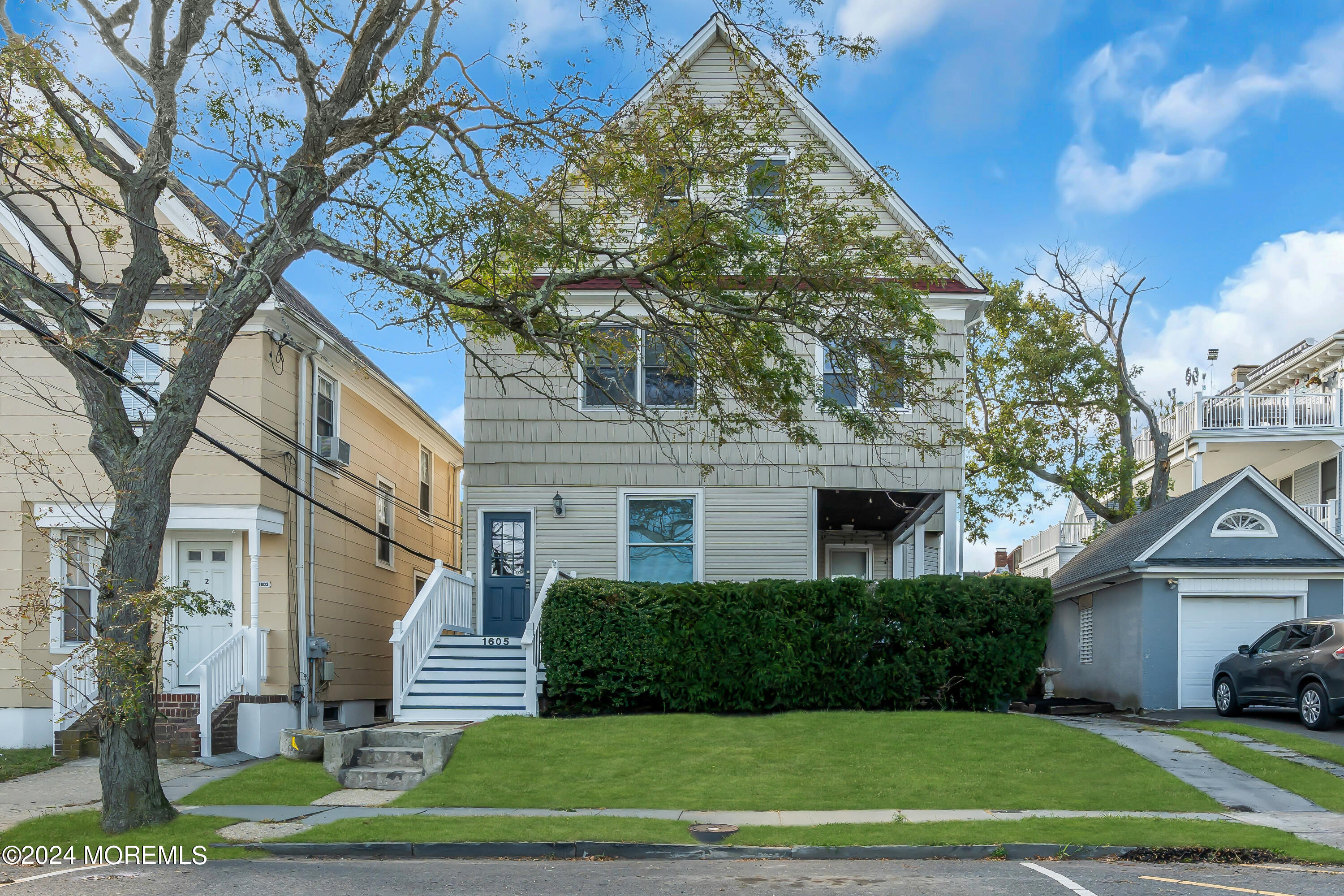 a front view of a house with a yard