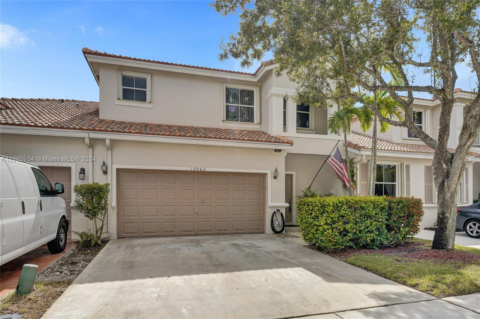 a front view of a house with a garage