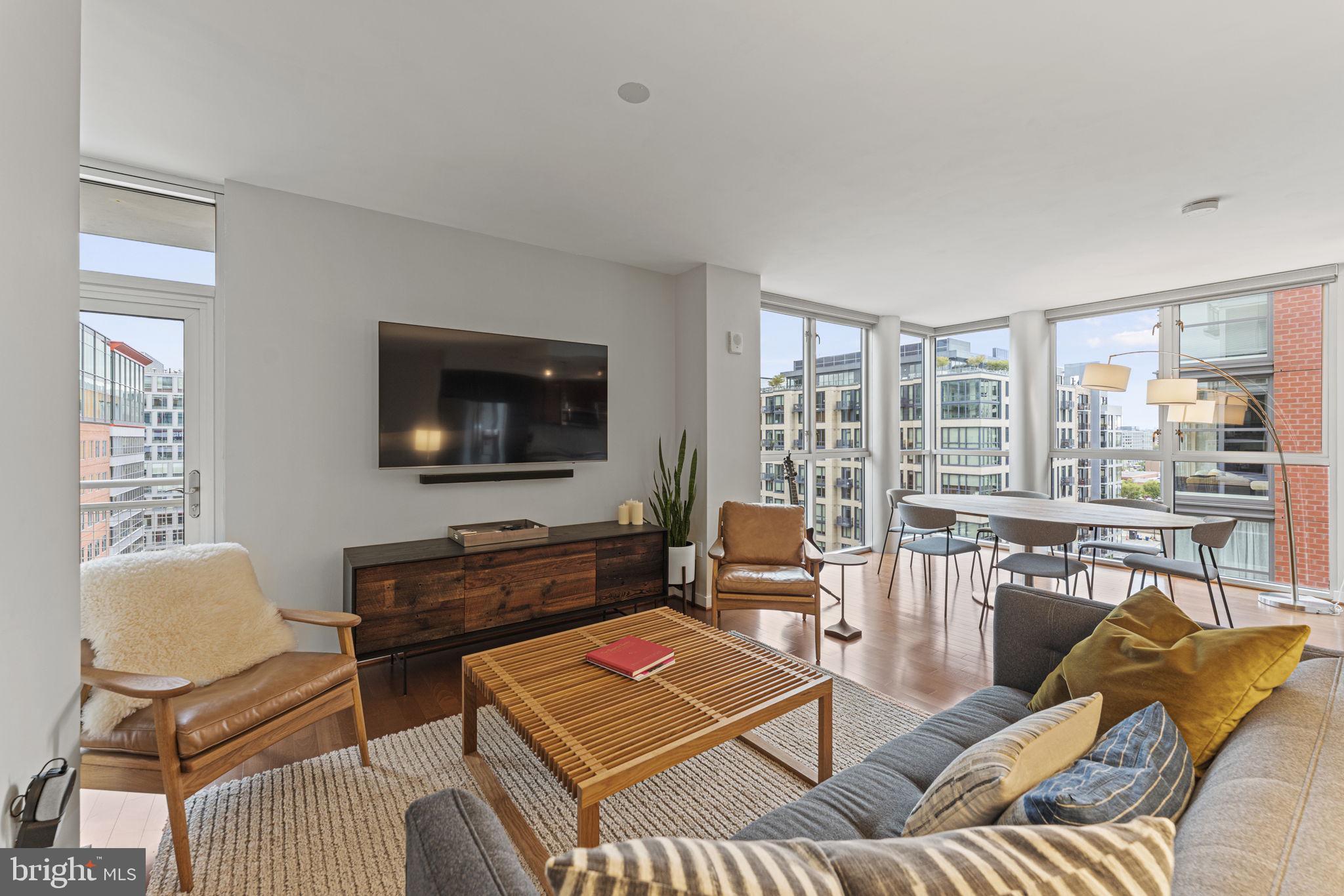 a living room with furniture and a flat screen tv