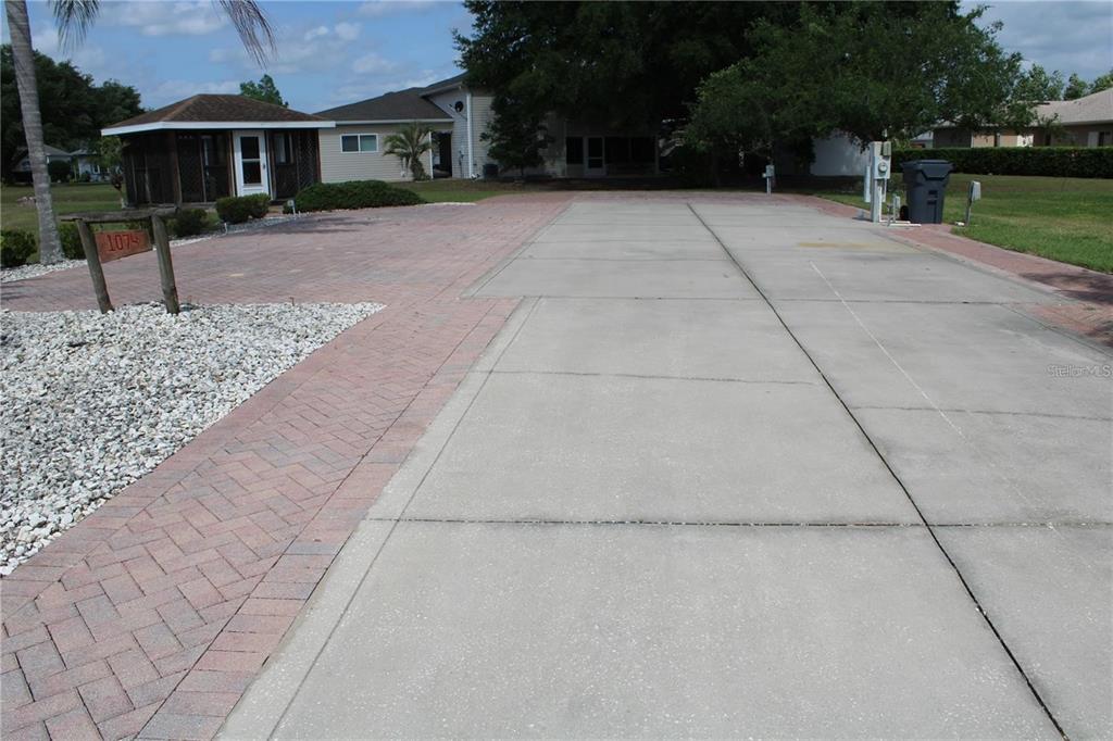 a view of house with yard and green space