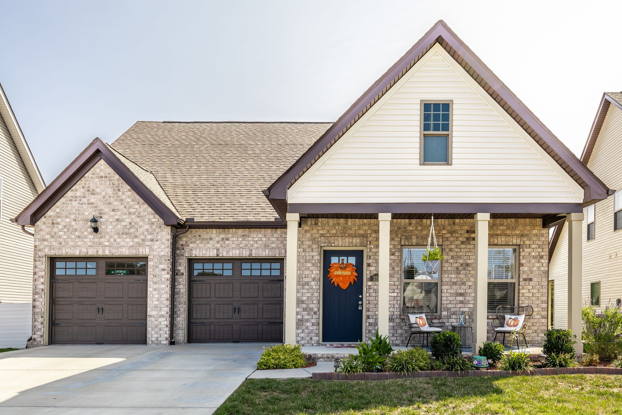 a view of a house with a yard and garage