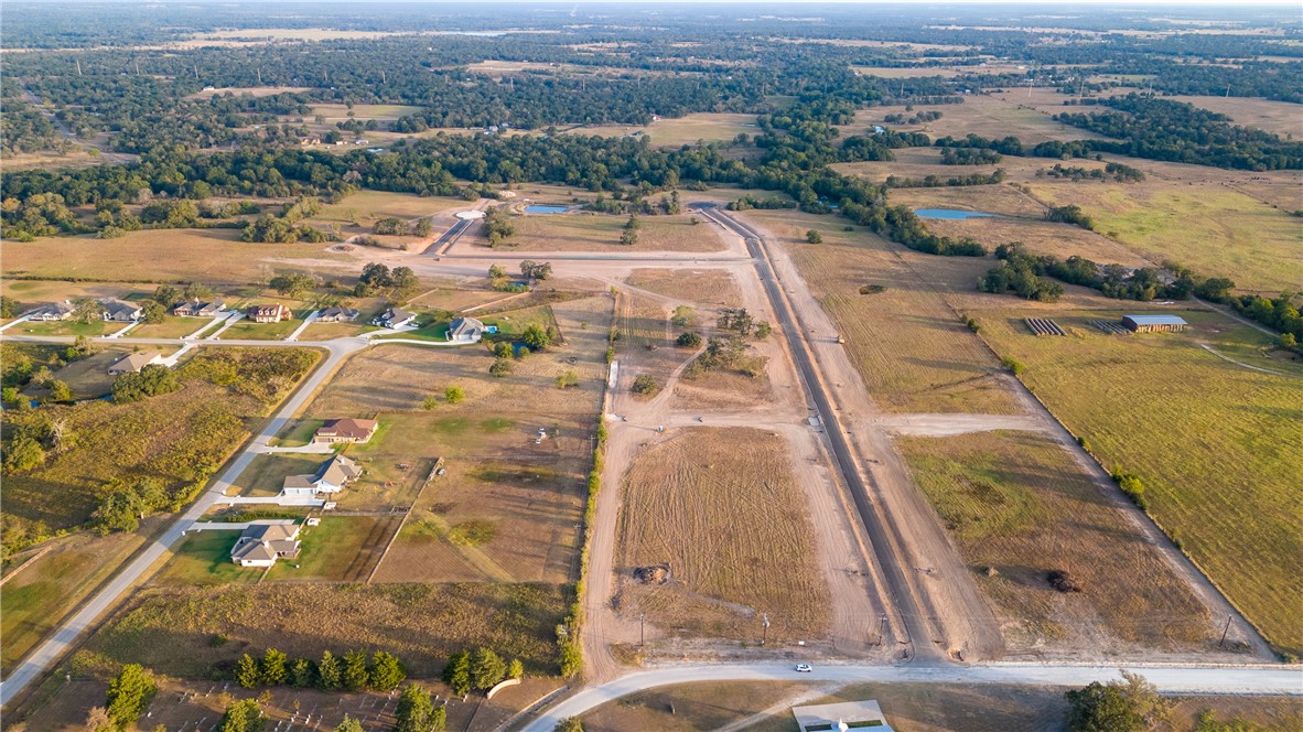 Birds eye view of property with a rural view