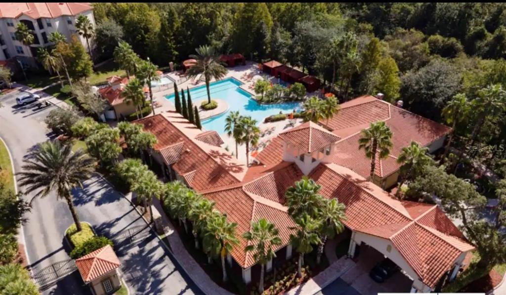 an aerial view of residential house with outdoor space and swimming pool