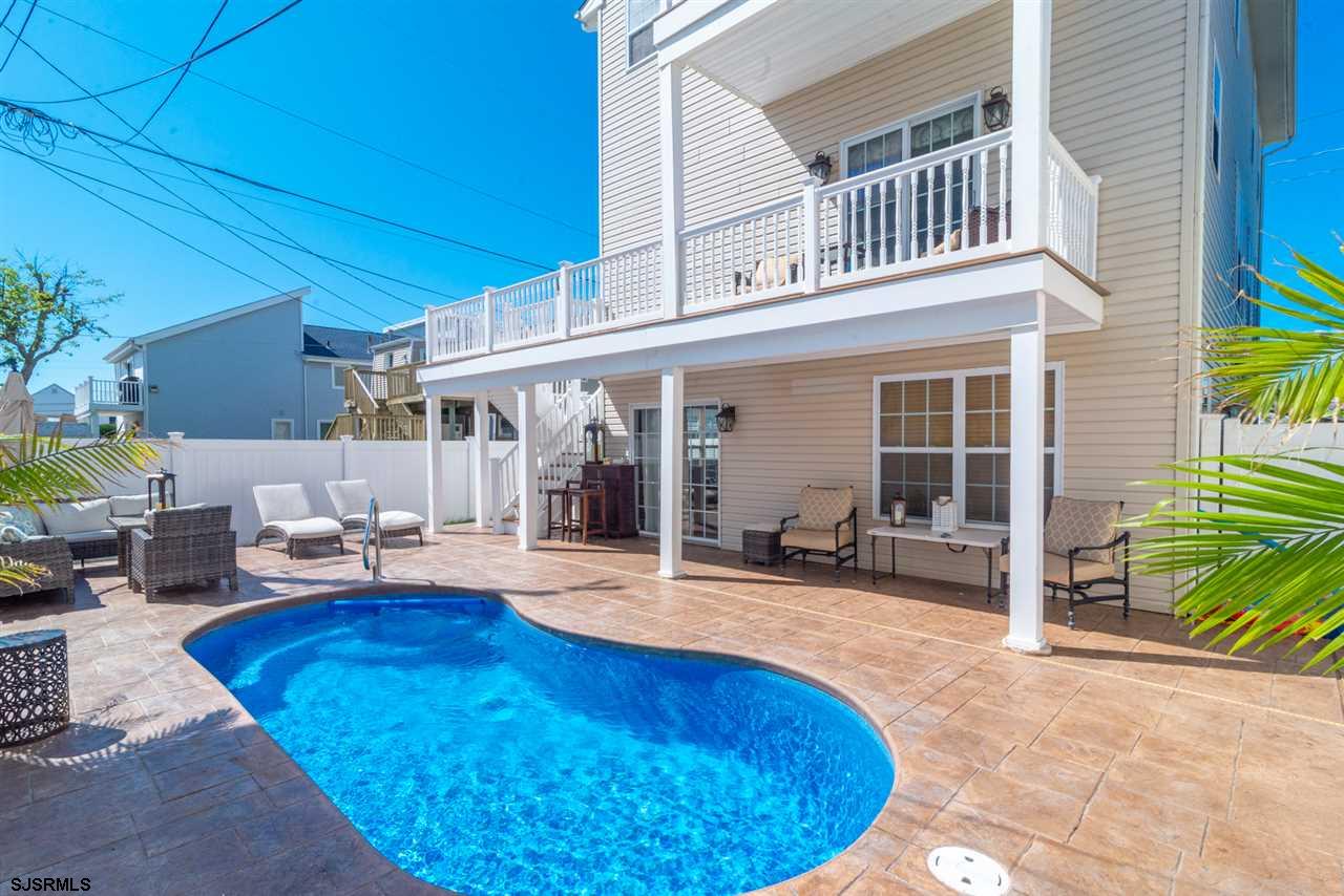 a view of a swimming pool with lounge chair