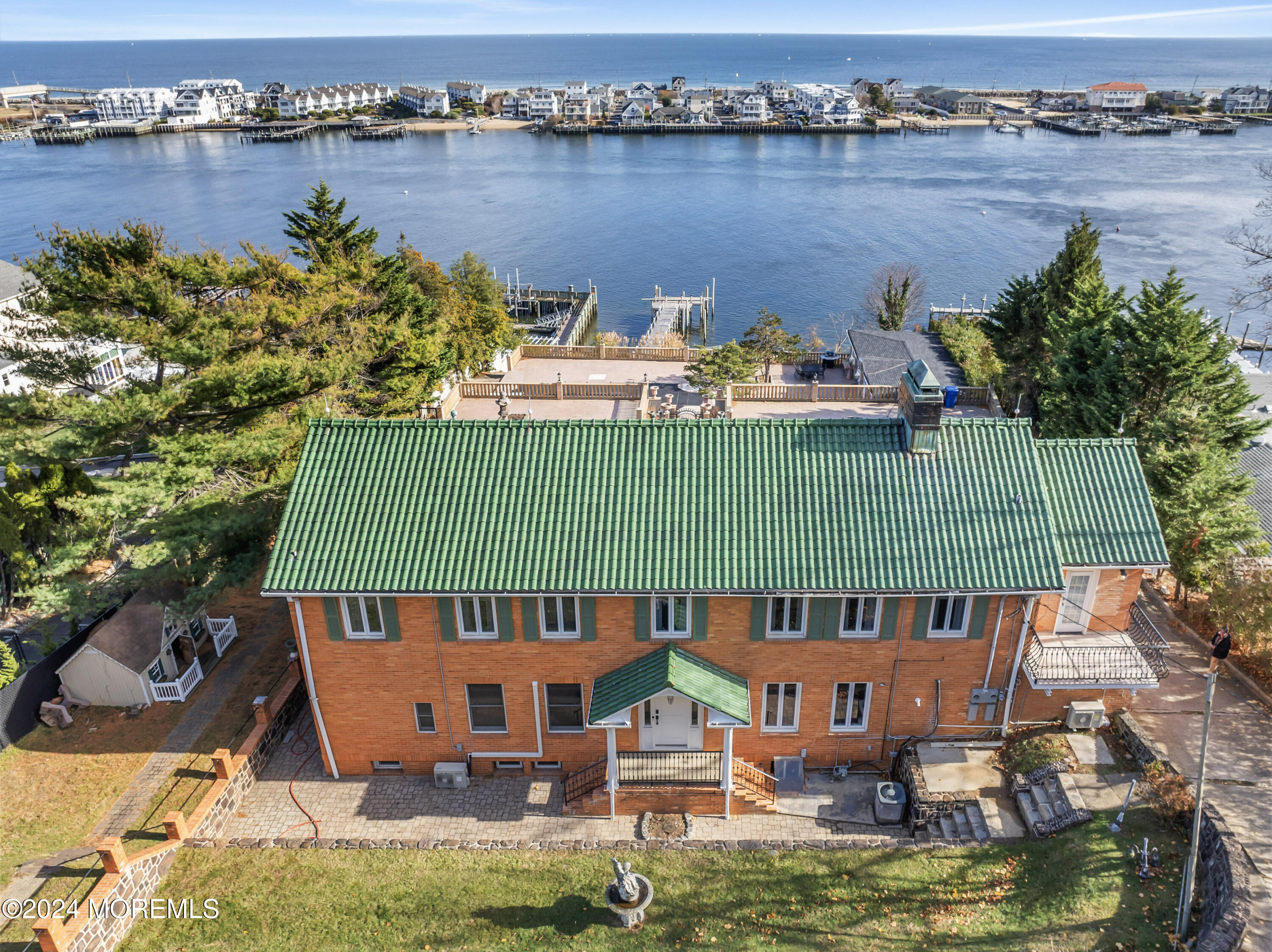 an aerial view of a house with a ocean view