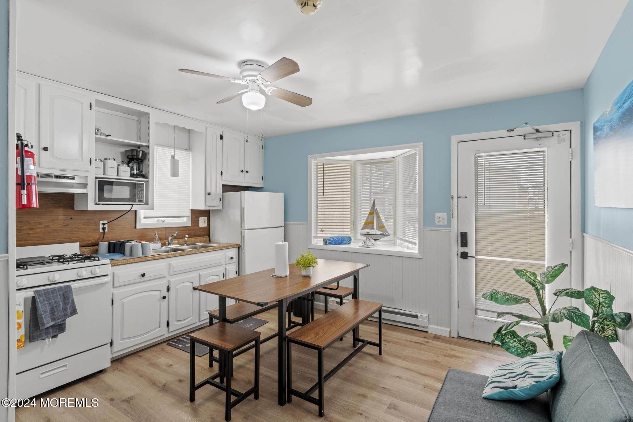 a kitchen with a table and chairs in it