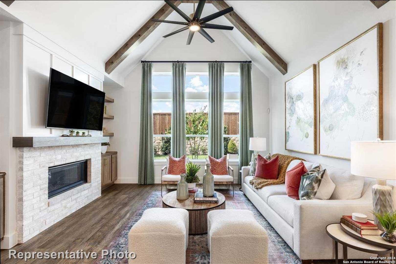 a living room with fireplace furniture and a flat screen tv