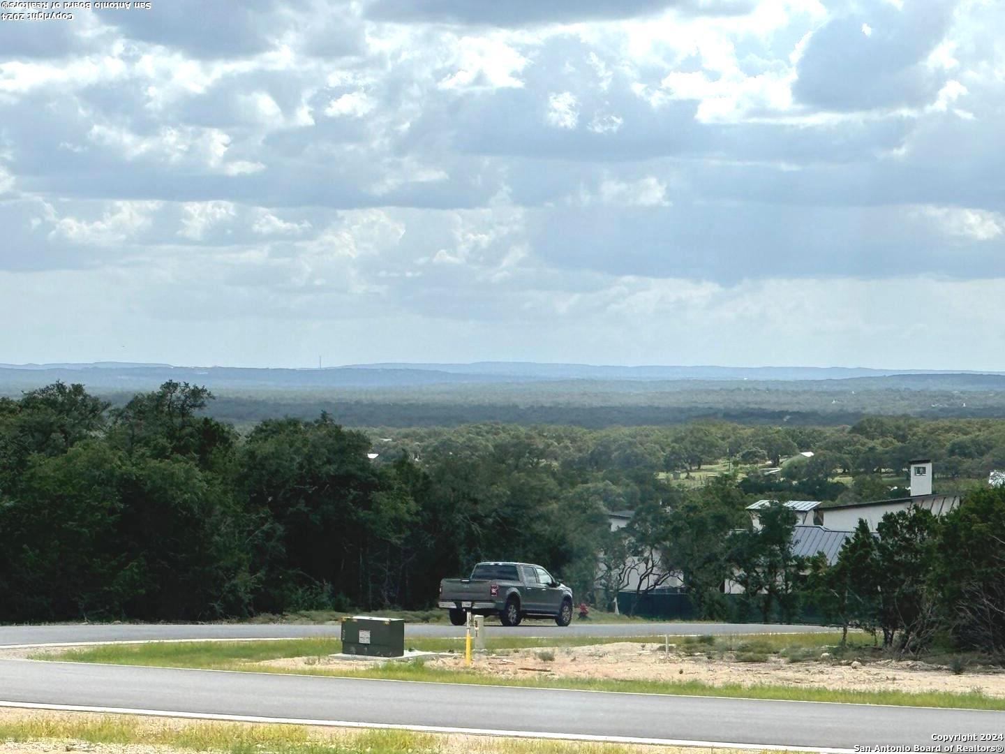 a view of lake with houses in the background